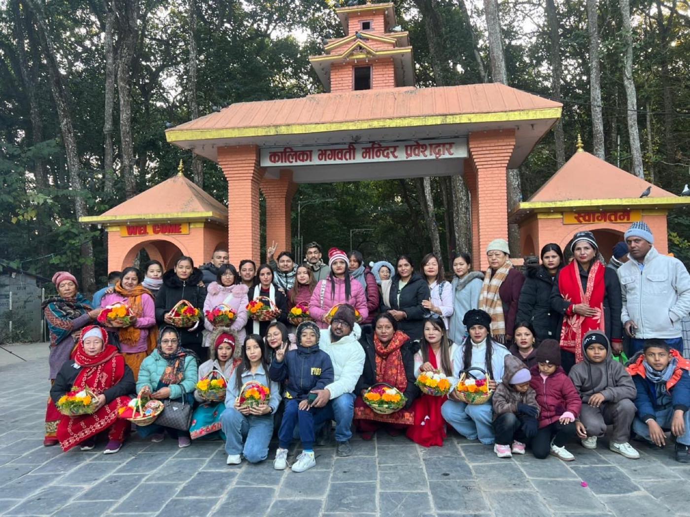 The Trishakti Apparel team on an outing at the Kalika Bhagwati temple gate in Chitwan, Nepal